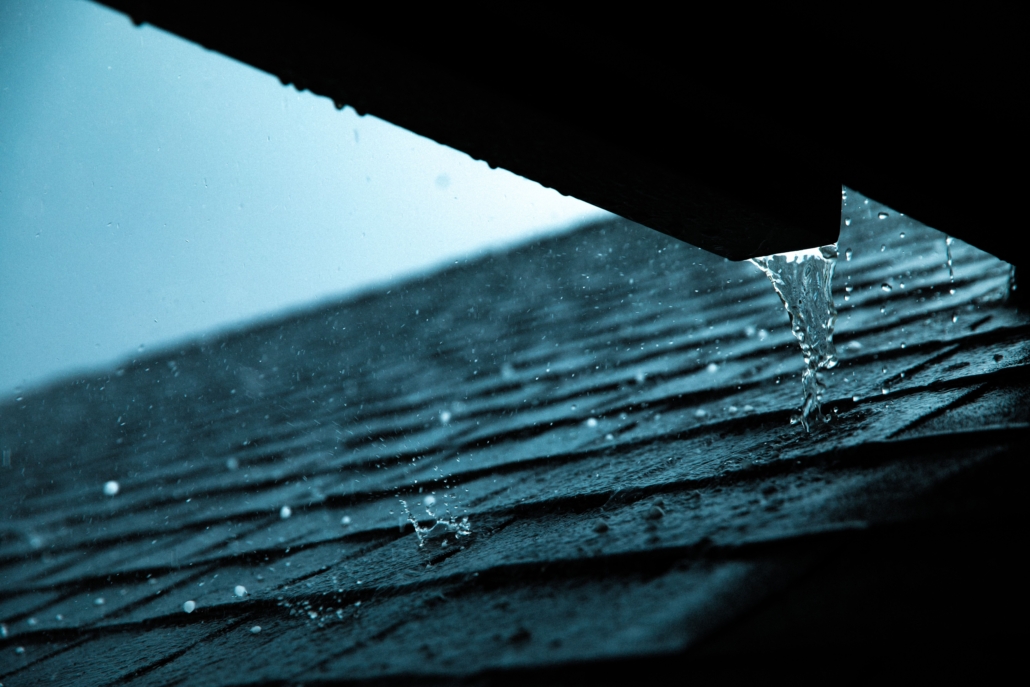 Shingles during heavy rain that will later need a roof inspection to check for damage.