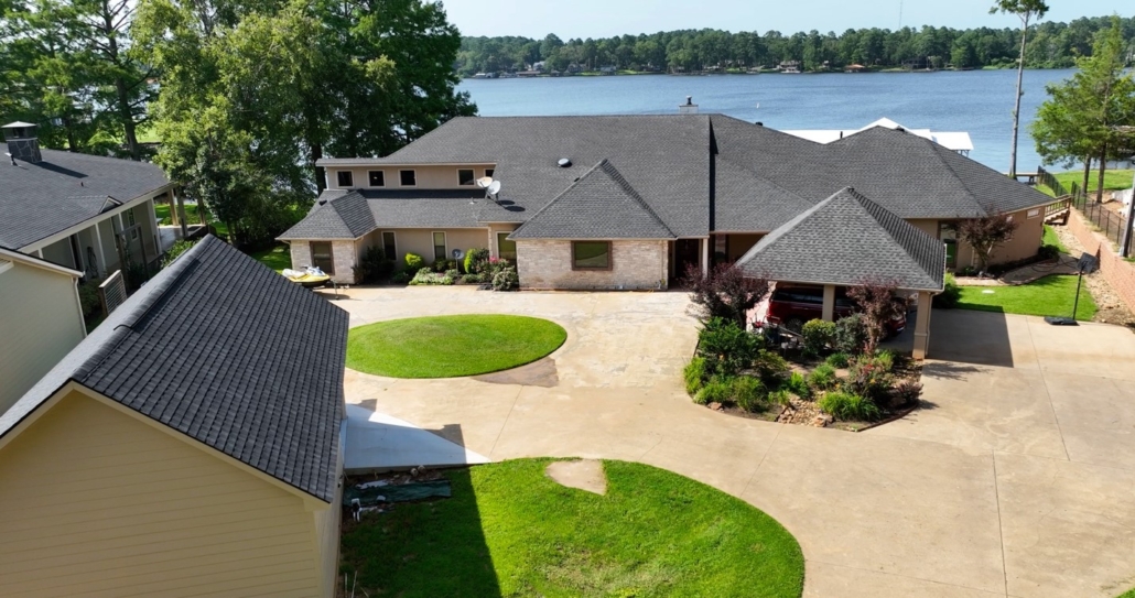 An aerial view of a house showcasing the high-quality roofing work performed by roofing contractors like Stonewater. 