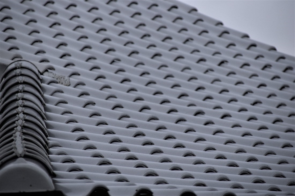 A close-up look at a roof made of tiles, showing the overlapping structure that makes modern roofs more energy efficient.