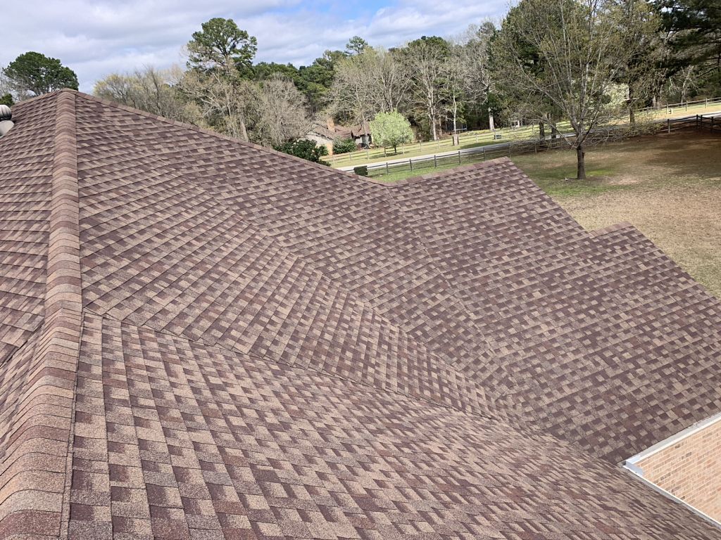 A home with asphalt shingles showcasing the great aesthetics these affordable shingles offer to Texas roofs.